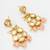 gold-toned kundan stud drop earrings with peach crackle bead drops