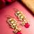 gold-toned kundan drop earrings with pearl cluster and stone