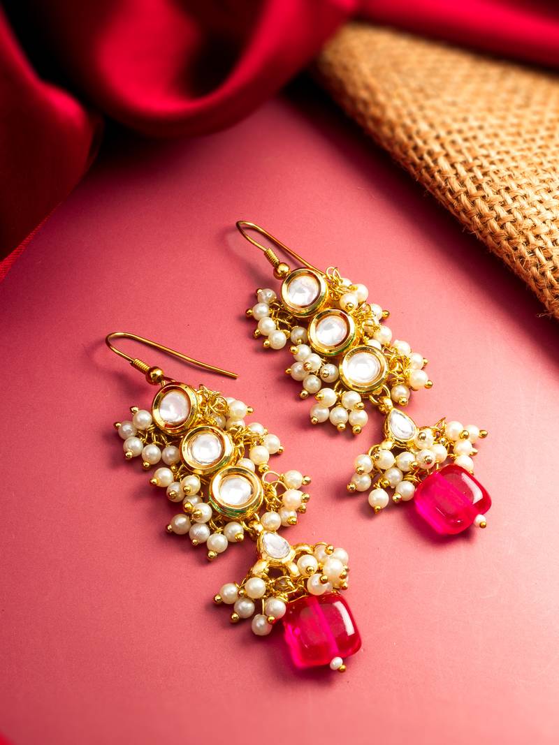 gold-toned kundan drop earrings with pearl cluster and stone