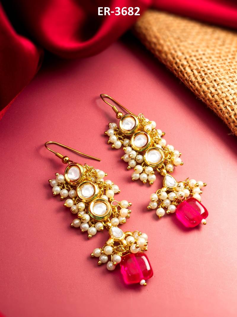 gold-toned kundan drop earrings with pearl cluster and stone