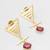 gold-plated textured triangle frame drop earrings with stone