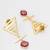 gold-plated textured triangle frame drop earrings with stone