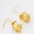 gold-plated textured cylindrical scroll hoop earrings with hook closure