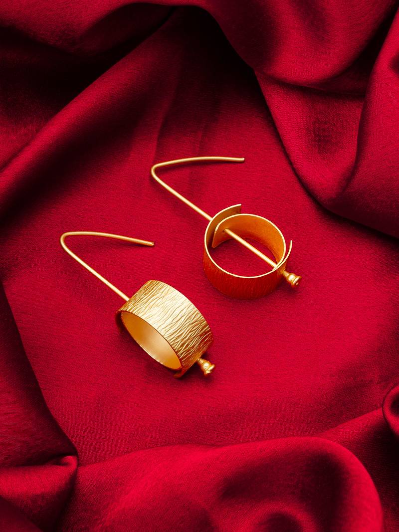 gold-plated textured cylindrical scroll hoop earrings with hook closure