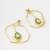 gold-plated octagon frame drop earrings with green stone