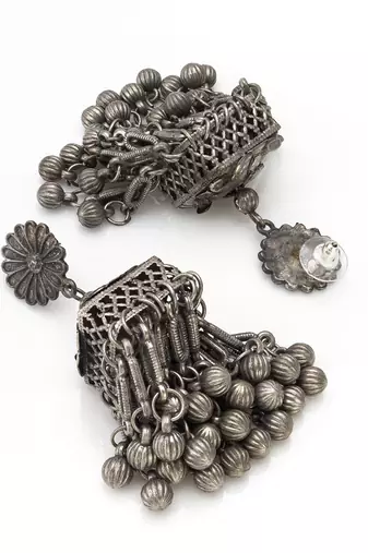 oxidized silver starburst jhumka earrings with ribbed ghungroo fringe and floral stud