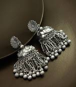 oxidized silver starburst jhumka earrings with ribbed ghungroo fringe and floral stud