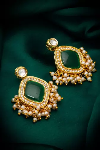 green stone kundan jhumka earrings with pearl
