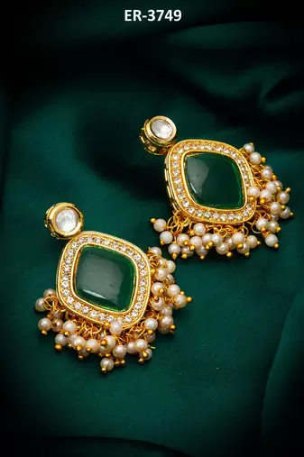 green stone kundan jhumka earrings with pearl