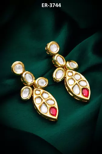 Traditional kundan drop earrings with red accent