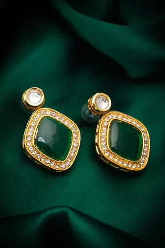 green stone gold tone stud earrings with crystal