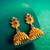 lotus design temple style jhumka earrings with stone