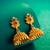 lotus design temple style jhumka earrings with stone