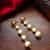 gold-toned graduated pearl drop earrings