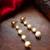 gold-toned graduated pearl drop earrings