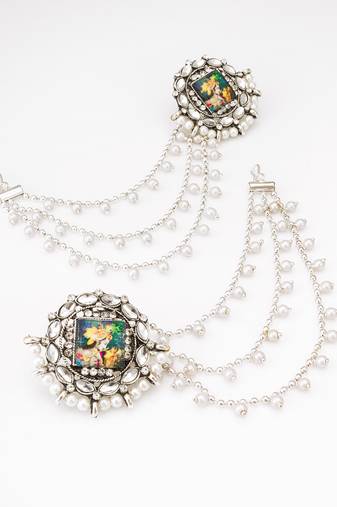 silver oxidized radha krishna earrings with pearl drop chains