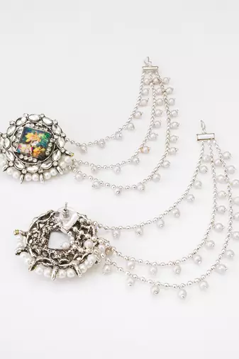 silver oxidized radha krishna earrings with pearl drop chains