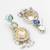 silver-toned drop earrings with pearl dangles