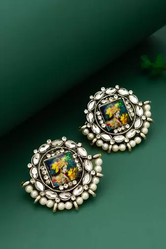 silver toned radha krishna temple work kundan stud earrings