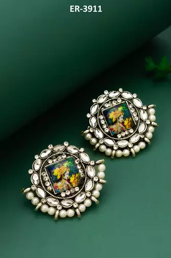 silver toned radha krishna temple work kundan stud earrings