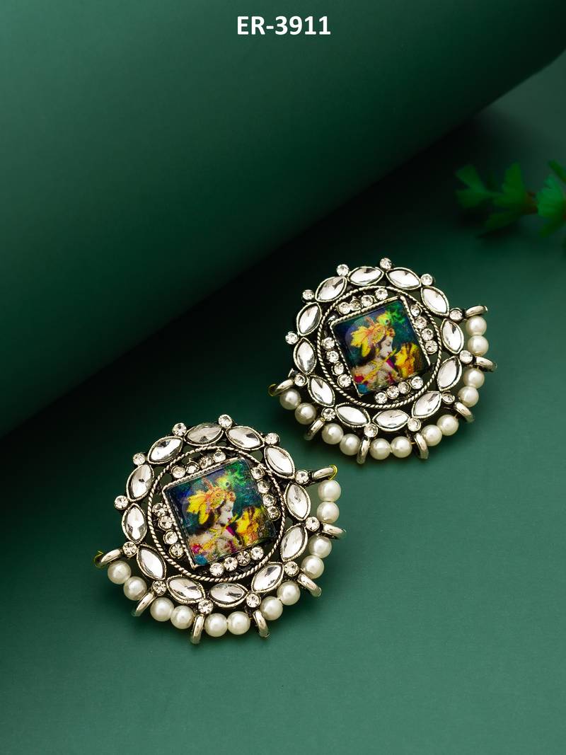 silver toned radha krishna temple work kundan stud earrings