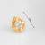 gold-plated circular swirl stud earrings with ad stone