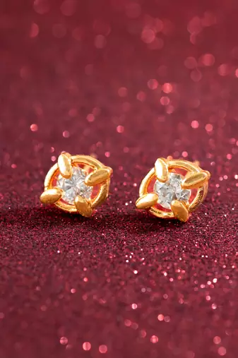 gold-plated circular swirl stud earrings with ad stone