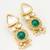 gold-toned kundan and green stone earrings with pearl drops