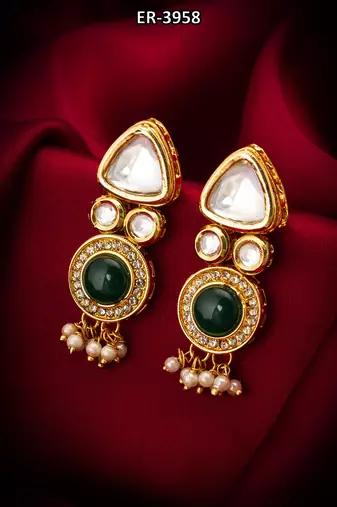 gold-toned kundan and green stone earrings with pearl drops