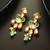 gold-plated kundan earrings with stones and drop