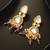 gold-plated kundan earrings with crystal bead drop