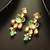gold-plated kundan earrings with stones and drop