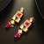 Geometric gold-plated kundan long drop earrings with pink accents and pearl beads