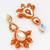 orange kundan drop earrings with beads and pearl