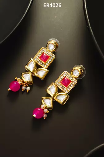 Geometric gold-plated kundan long drop earrings with pink accents and pearl beads