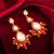 orange kundan drop earrings with beads and pearl