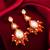orange kundan drop earrings with beads and pearl