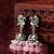 oxidized silver peacock jhumka earrings with rose pink jade-style beads and pearl clusters