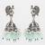 oxidized silver peacock jhumka earrings with mint green beads and pearl