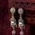 oxidized silver buddha face drop earrings with grey stone pendant