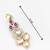 dual-tone ruby red and kundan studded traditional dangler earrings