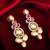 dual-tone ruby red and kundan studded traditional dangler earrings