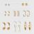 elegant gold plated pearl & crystal hoop earring combo set for women (pack of 9 pairs)