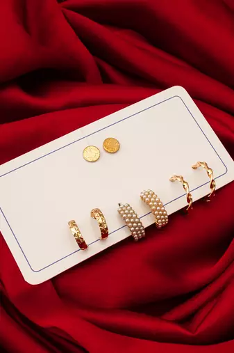 gold plated pearl huggie and textured hoop set