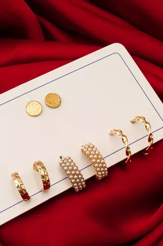 gold plated pearl huggie and textured hoop set