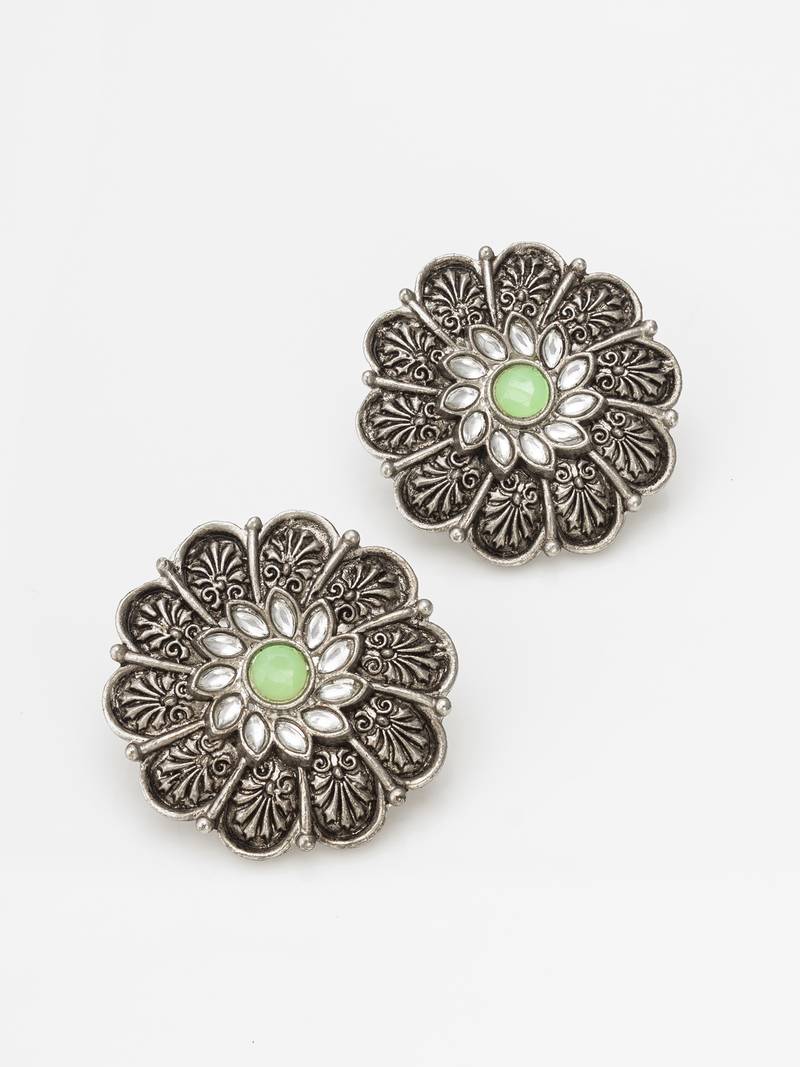 oxidized floral motif stud earrings with green stone