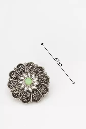 oxidized floral motif stud earrings with green stone