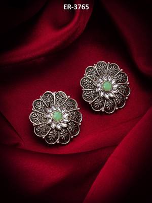 oxidized floral motif stud earrings with green stone 5