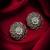 oxidized floral motif stud earrings with green stone