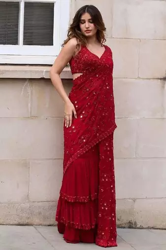 Red georgette embroidered saree with mirror work and ruffled skirt